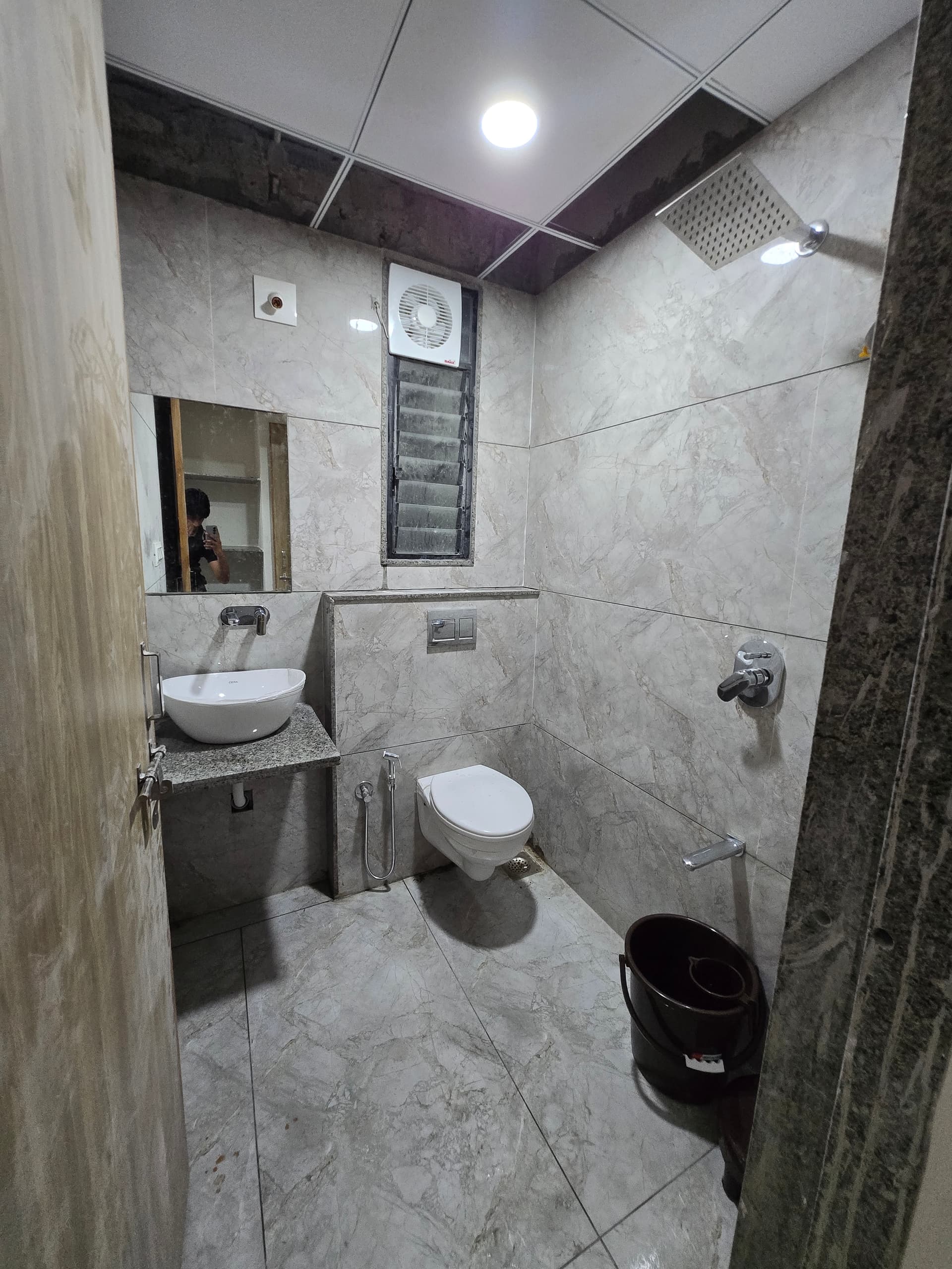 Attached clean bathroom in single room at Mansarovar Girls PG, Navrangpura, Ahmedabad