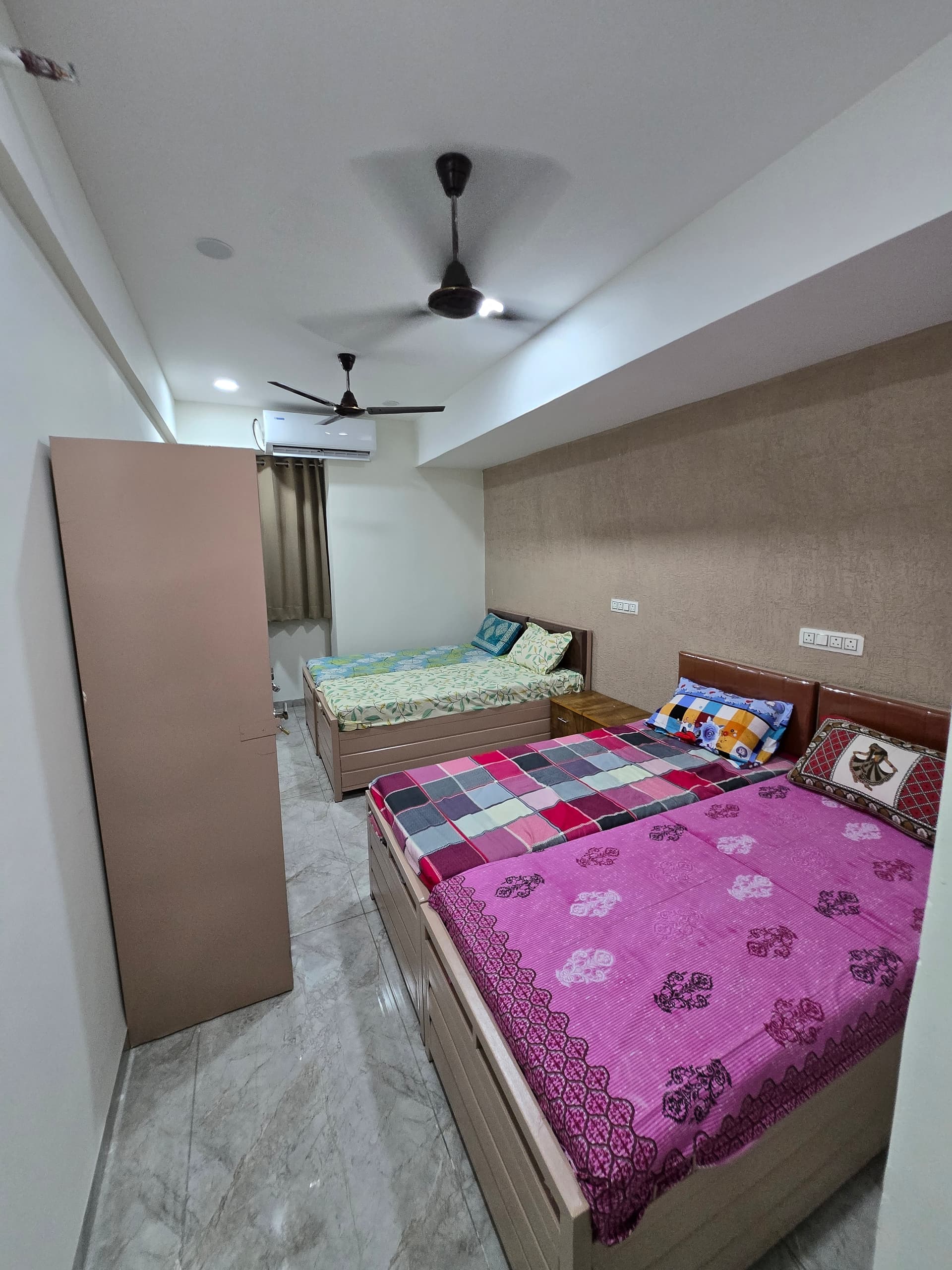 Four sharing room at Mansarovar Girls PG, budget girls PG near GLS University Ahmedabad
